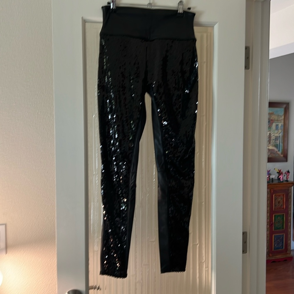 Spanx faux leather with sequence on the front all the way down the leg.